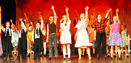 The children's cast perform the rousing final chorus from Dazzle The Musical