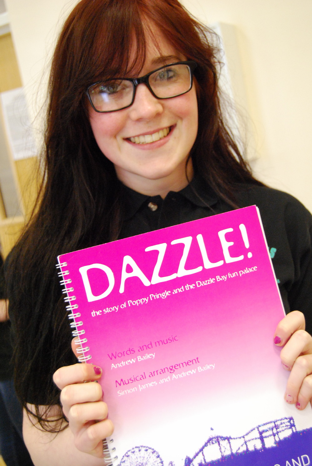 CTYS member with script of Dazzle the children's musical