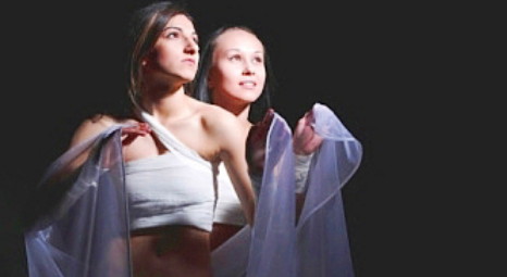 Two girls on stage during performance of school musical